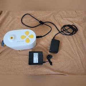 USED Medela Pump In Style with portable battery and charger.